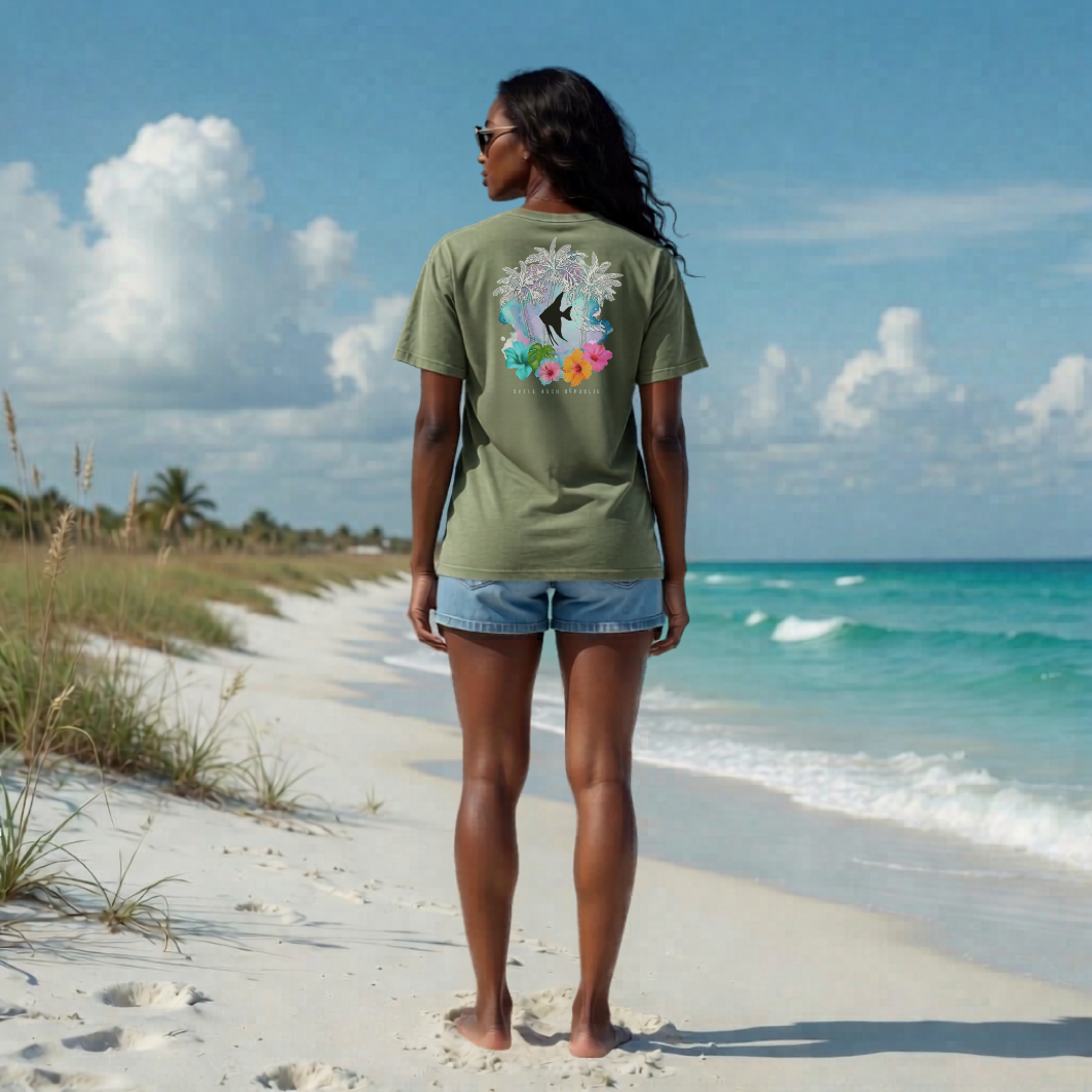 Woman on beach wearing Shell Hash Republic Comfort Colors Black Angelfish T-Shirt with tropical graphic
